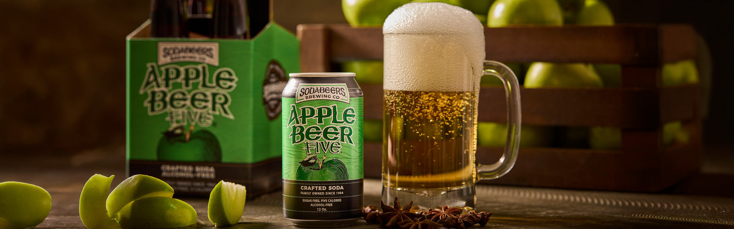 SodaBeers Apple Beer can and mug with green apples in the background